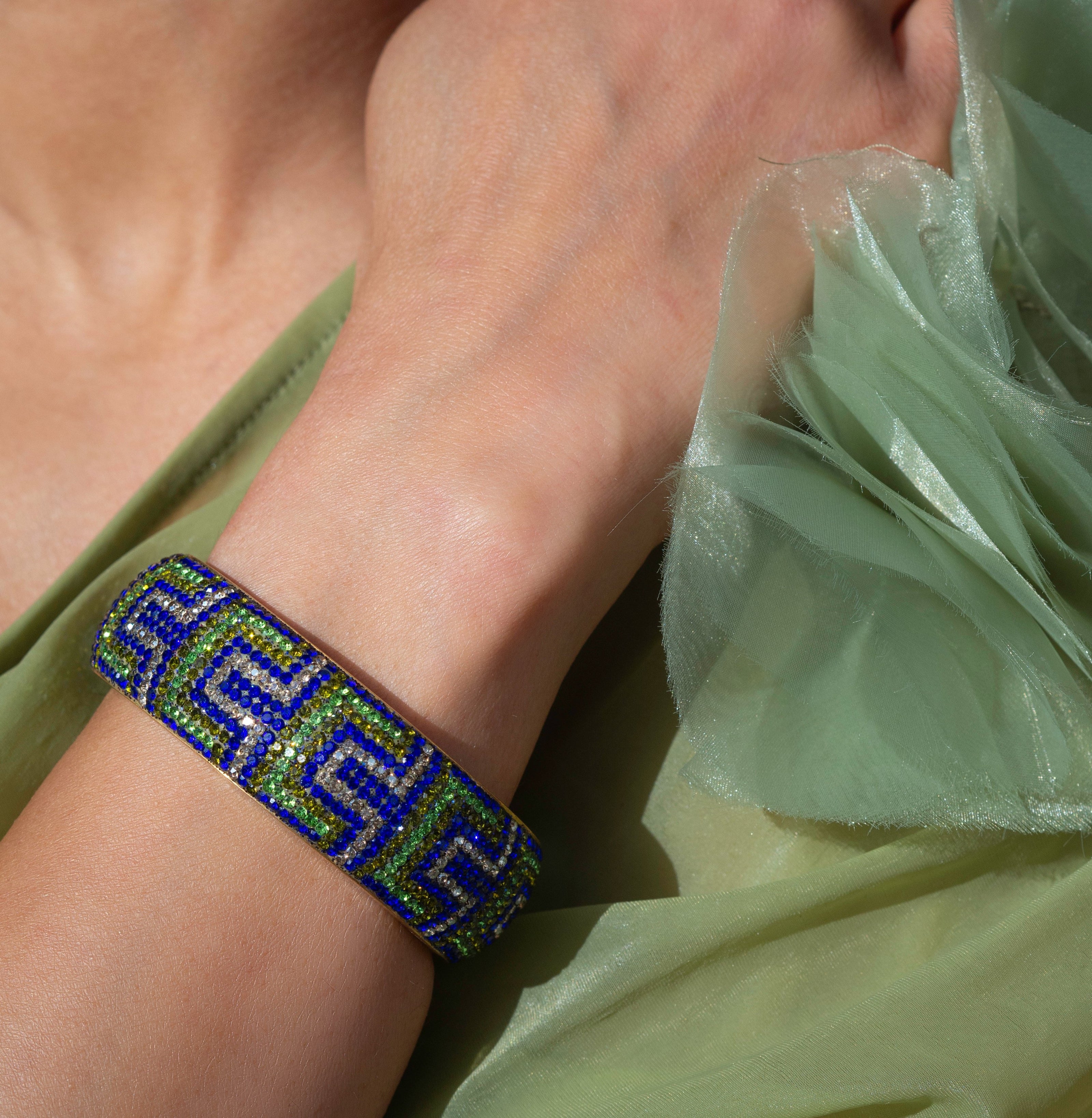 80DB Deco Anthem cuff in blue and green hues, showcasing architectural Art Deco inspired pattern with dramatic geometric elements