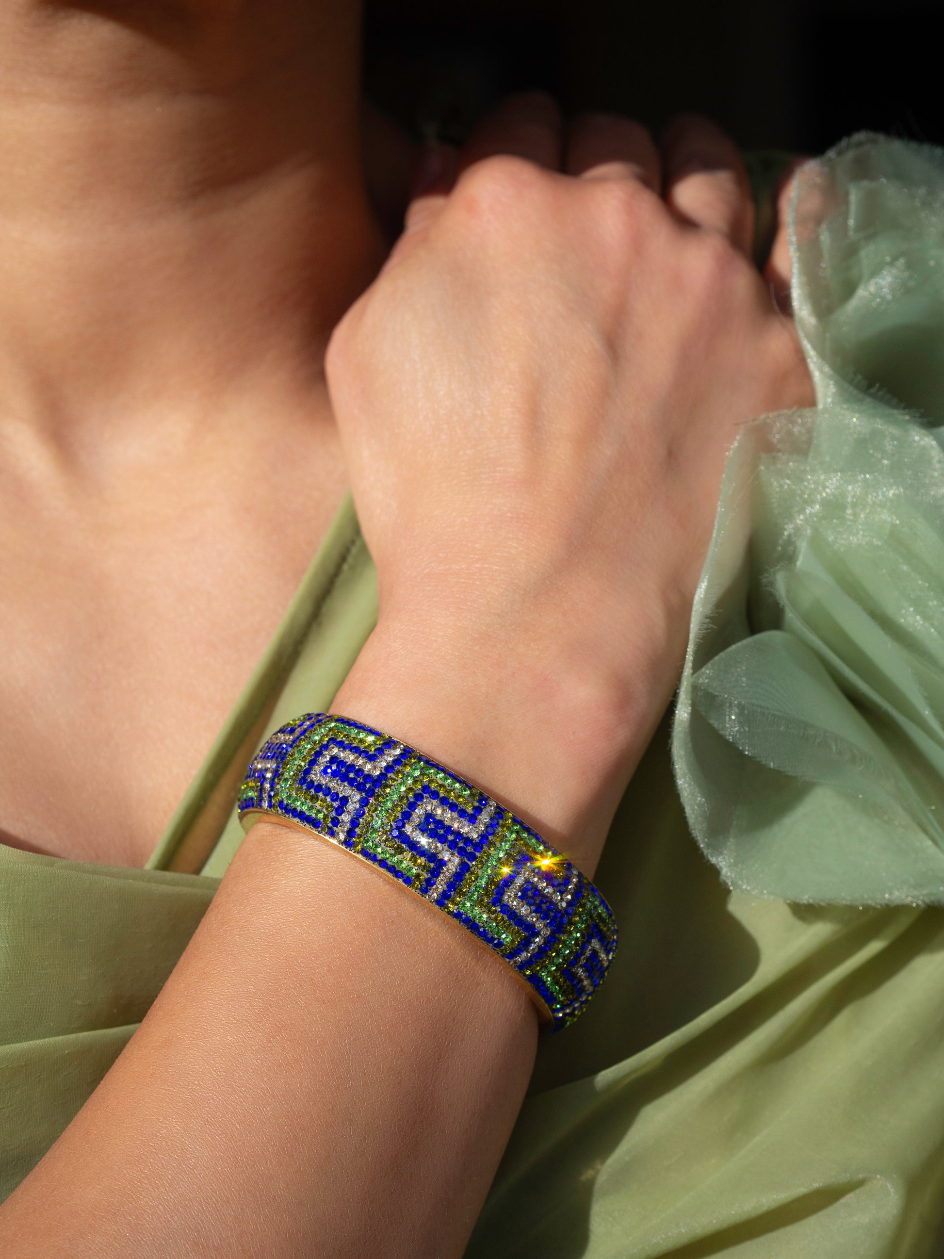 80DB Deco Anthem cuff in blue and green hues, showcasing architectural Art Deco inspired pattern with dramatic geometric elements