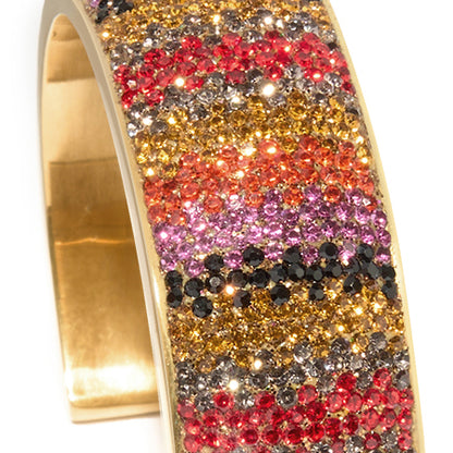 80DB Spectrum Symphony cuff featuring a vibrant multi-coloured crystal pattern that creates a bold visual symphony of red, yellow and striking hues