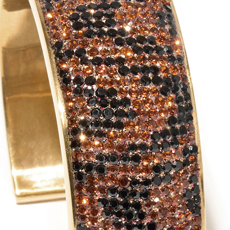 80DB Roaring Rhythm cuff with animal-inspired dark brown and black crystal stones in a wavy design