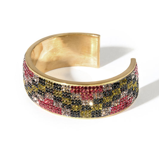 80DB Empress Crescendo cuff featuring a bold checkered pattern in black, red and grey with light -reactive green crystals creating a dynamic play of colour.