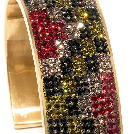 80DB Empress Crescendo cuff featuring a bold checkered pattern in black, red and grey with light -reactive green crystals creating a dynamic play of colour.